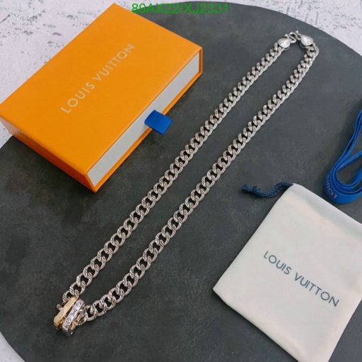 Louis Vuitton branded packaging and silver chain accessory.