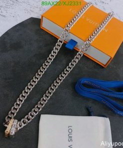 Silver chain necklace on Louis Vuitton packaging.